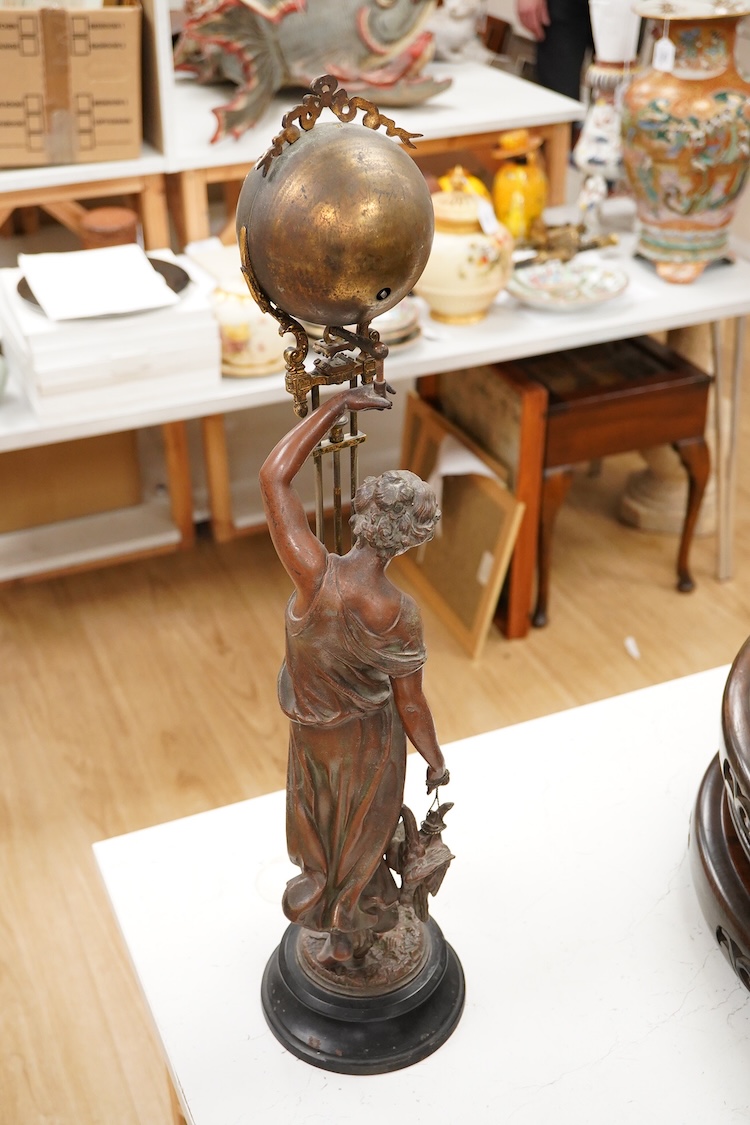 A late 19th century spelter figural mystery clock, 63cm high